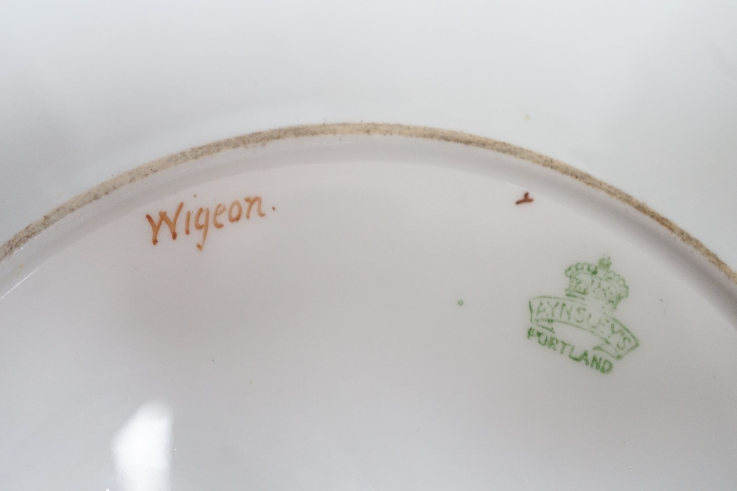 A late 19th century Aynsley pair of plates painted by F. Micklewright each signed, with a Widgeon or Wood Pigeon named verso 22cm